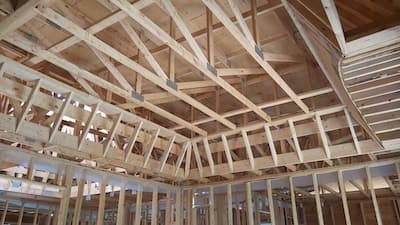 Picture of the beams inside the roof of a house under construction